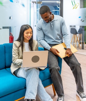 coworkers collaborating on project in modern office
