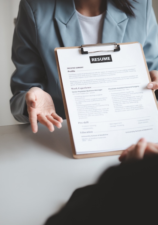 Person submitting resume to interview for a job with a company, Person attending a job interview with a manager to be recruited to the company for the position applied for. Job application concept.